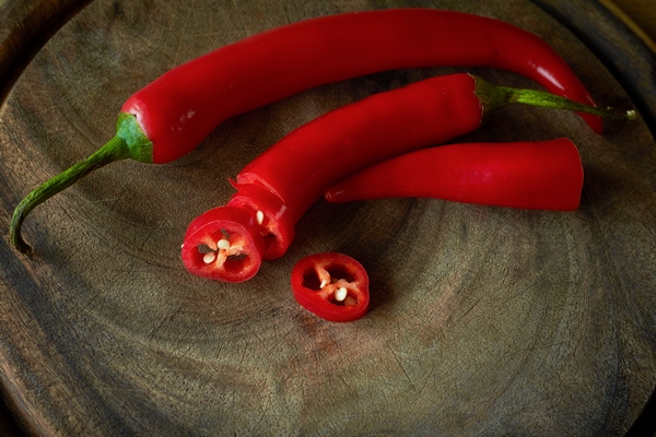 close up of sliced red hot chili peppers - Постная яблочная аджика с базиликом