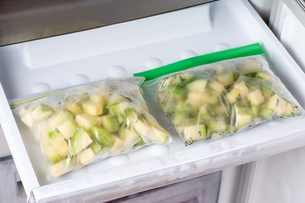 frozen zucchini in the freezer frozen food concept horizontal - Замороженные яблоки на зиму