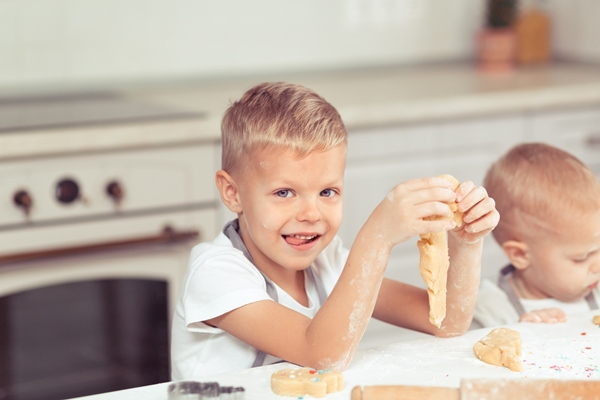 kid making homemade cookies in the domestic kitchen at home 1 - Как научить ребенка готовить?