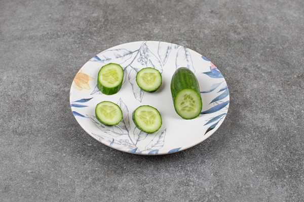 sliced fresh organic cucumber on white plate - Бутерброды "Золотая рыбка"