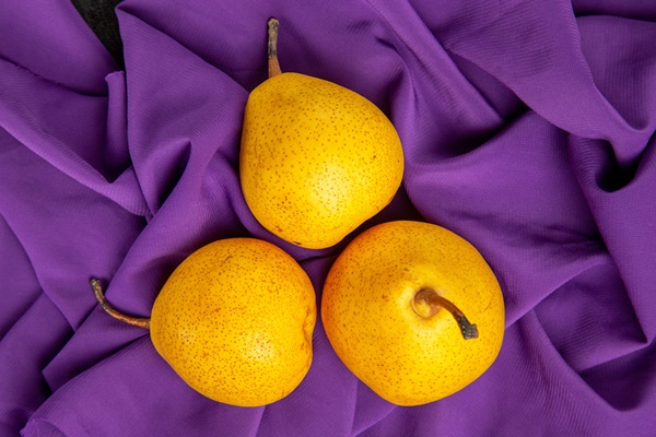 top close up view pears on the tablecloth three appetizing pears on the purple tablecloth - Фруктовый салат "Ёжик"
