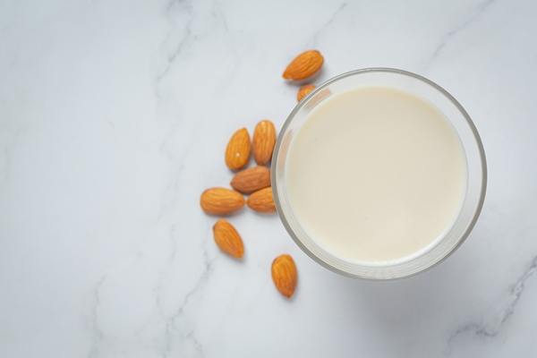 almond milk with almond on marble background - Постный салат "Мимоза" с рыбой