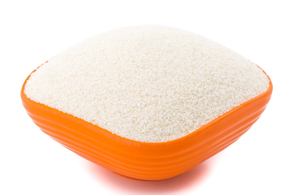 raw unprepared semolina flour or suji on white background - Торт «Наполеон» постный