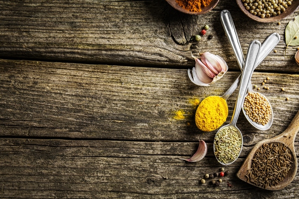 spices in spoons on wooden background - Постные капустные оладьи