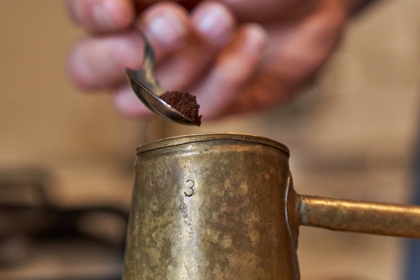 anonymous man preparing coffee in cezve - Кофе с сахаром и солью в турке