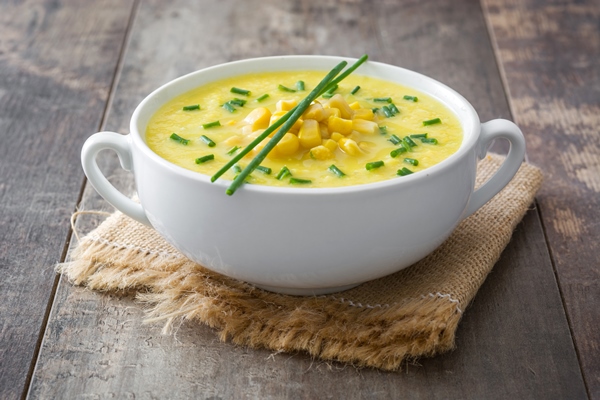 corn soup in bowl on wooden - Суп-пюре картофельный с молоком