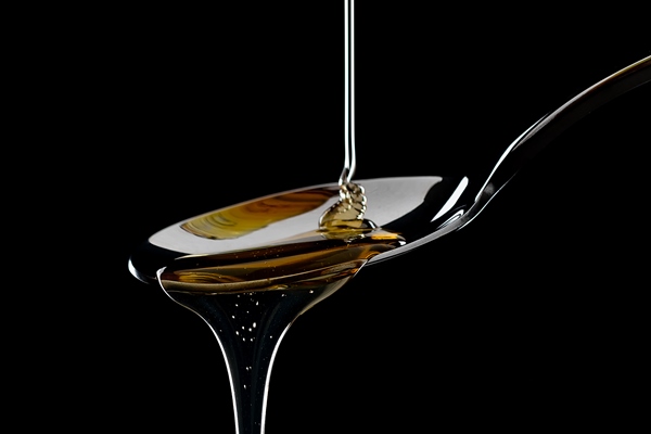 golden sweet honey dripping from spoon - Латте