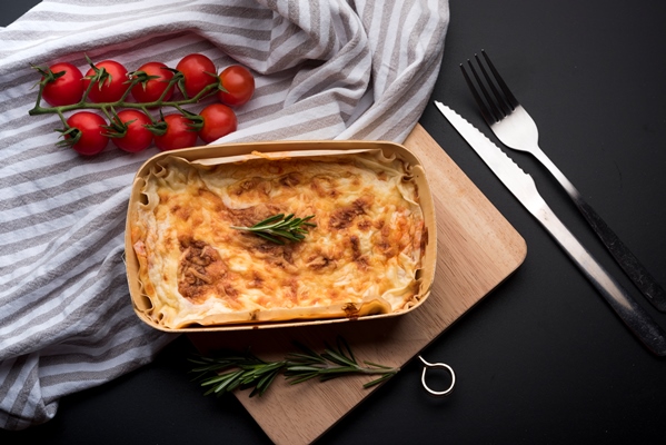 high angle view of tablecloth fresh ingredient and delicious lasagna - Бульон с рисовым пудингом
