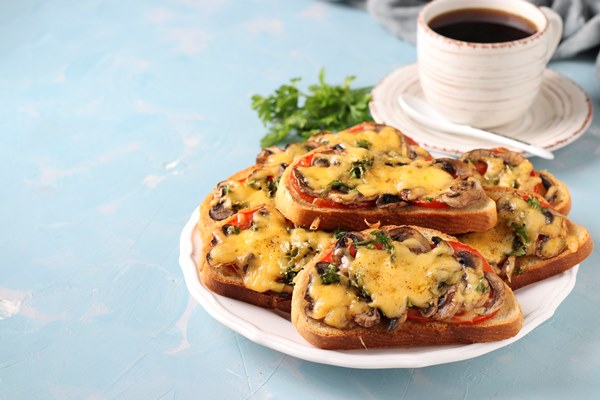 hot sandwiches with tomatoes champignons cheese and cup of coffee on a light blue background 1 - Горячие бутерброды