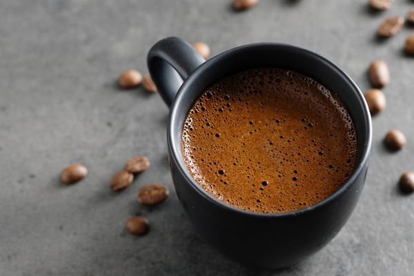 steaming espresso cup on grey background closeup - Пряный рождественский кофе