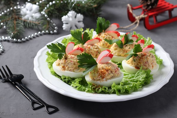 stuffed eggs with crab sticks a delicious festive snack closeup christmas composition 1 - Фаршированные яйца с крабовыми палочками