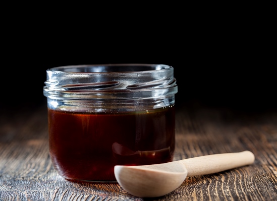 thick and sweet buckwheat honey of dark red color - Безалкогольный глинтвейн на смеси соков