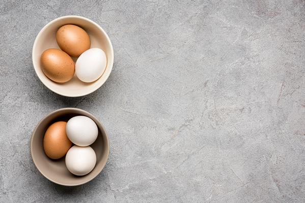 top view bowls with chicken eggs - Котлеты, фаршированные яйцом