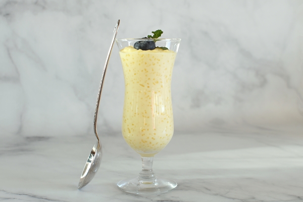 a glass of lemon curd with a spoon on it - Грейпфрутовый соус