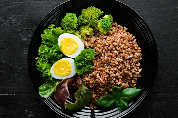 boiled buckwheat with egg and broccoli dishes menu free copy space top view - Гречневая каша с яйцом