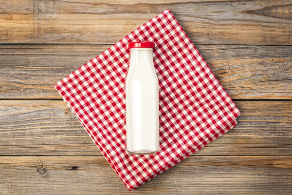 bottle of milk on a wooden white background flat lay - Рыбный суп-пюре