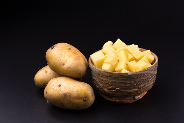 chopped potato in a bowl - Сливочный суп с грибами и булгуром