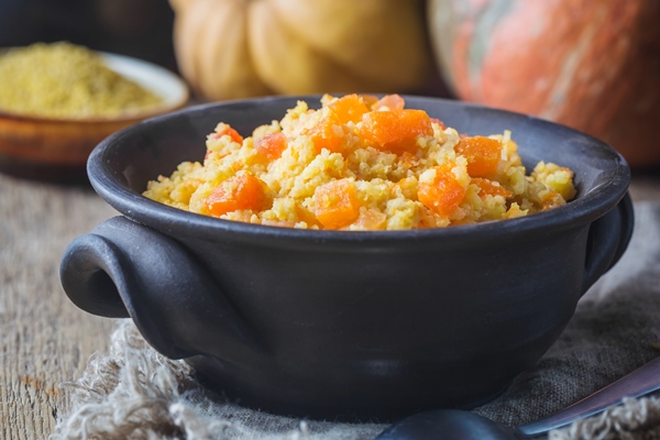 millet porridge with sweet pumpkin in a bowl rustic style healthy vegan dish - Пшённая молочная каша с тыквой