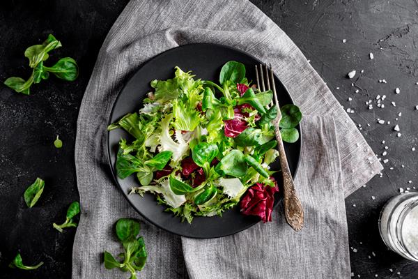 top view fresh green salad in dark bowl - Салат овощной с курицей