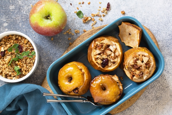 diet healthy dessert baked apples with walnuts honey and granola top view - Монастырская кухня: жареная зубатка, запечённое яблоко с орехами