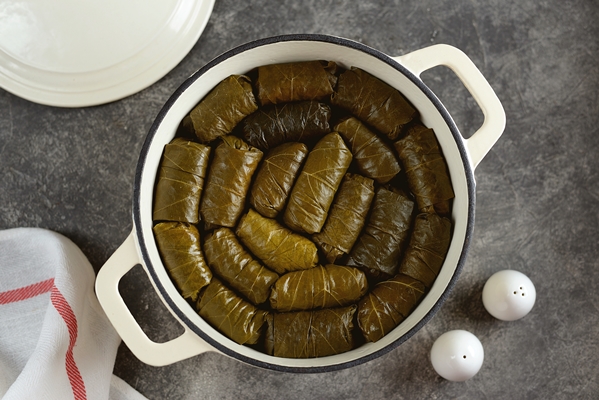 dolma tolma sarma stuffed grape leaves with minced meat rice onion and carrot traditional greek turkish ottoman and caucasian cuisine - Долма