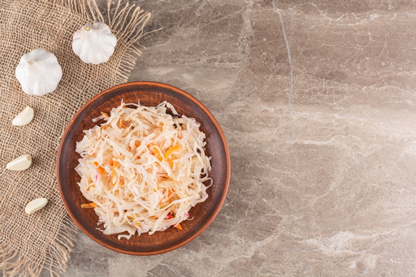 fermented vegetables sauerkraut placed on stone table - Монастырская кухня: луковые котлеты, пшенная каша