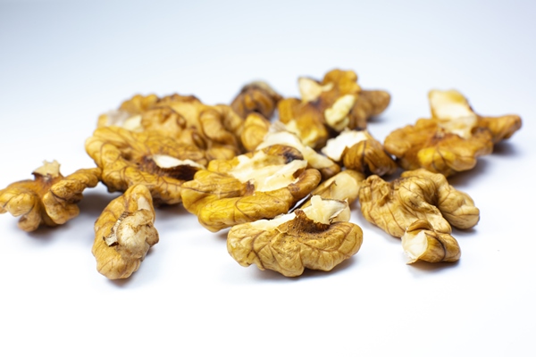 greece nuts close up of walnuts on white background food for brain energy - Монастырская кухня: пшённые галушки, ореховая тарталетка