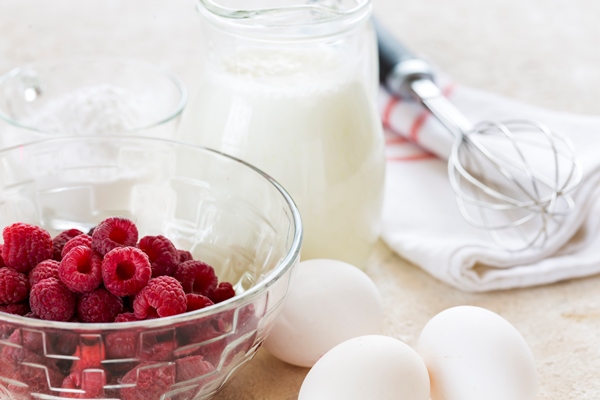 ingredients for making raspberry mousse on a white table recipe diet food - Блинный торт с заварным кремом