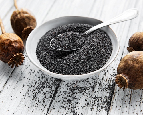 poppy seeds in small bowl on the wooden background - Коливо по-монастырски на пятницу