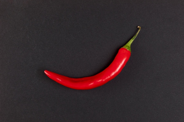 red hot chili pepper on black background - Монастырская кухня: перловая каша с овощами, паштет из фасоли