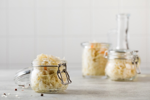 sauerkraut in glass jars fermentation and canning of vegetables copy space - Монастырская кухня: суп из красной фасоли, драники