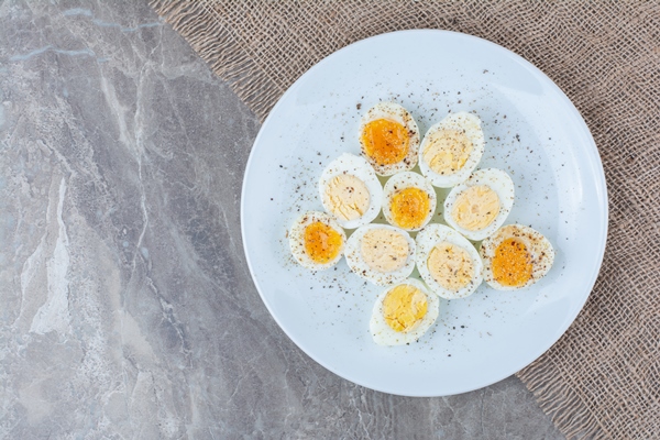 boiled tasty eggs with spices on white plate high quality photo - Пасхальный каравай "Касатьелло"