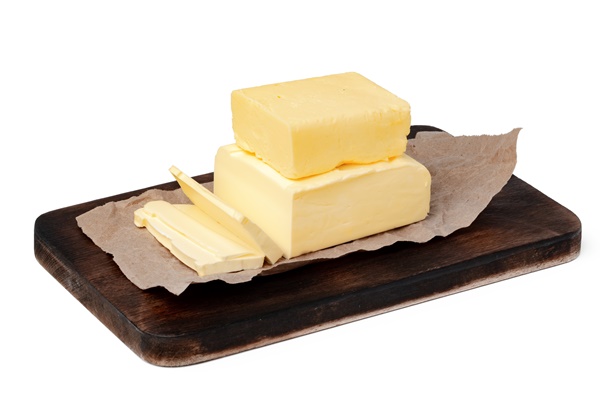 butter on wooden board isolated on white background - Кулич быстрого приготовления
