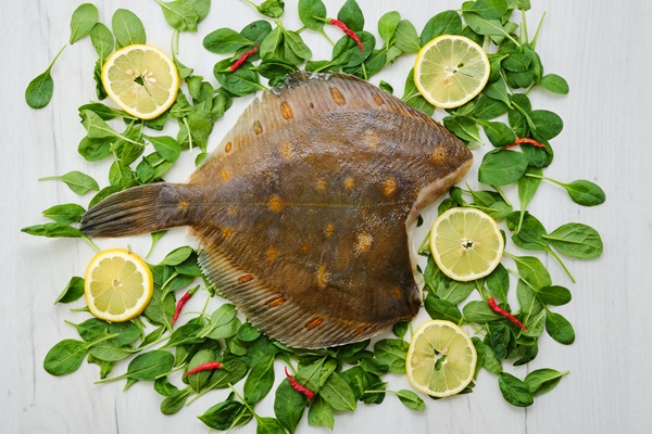 fresh flounder without head top view - Камбала по-матросски