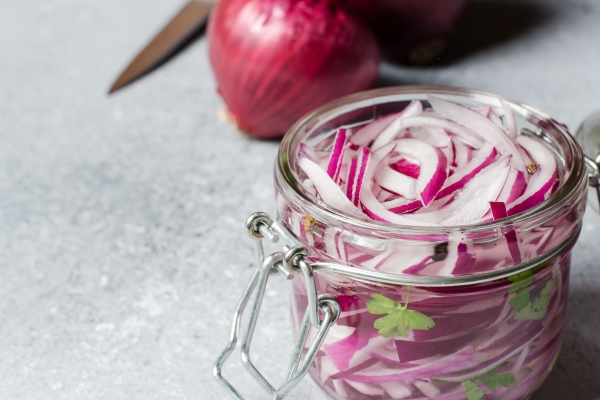 pickled chopped red onion in vinegar in a glass jar delicious side dish for meat and fish dishes light grey - Рыба с чесночно-ореховым соусом