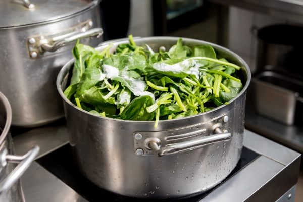 steamed vegetables in a pan spinach and broccoli - Постные лепёшки с зеленью (кутабы)
