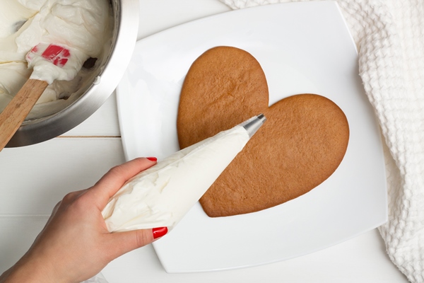 step by step heart shaped cake recipe instructions step 9 put the cream in a pastry bag flat lay - Морковно-творожный мазурек