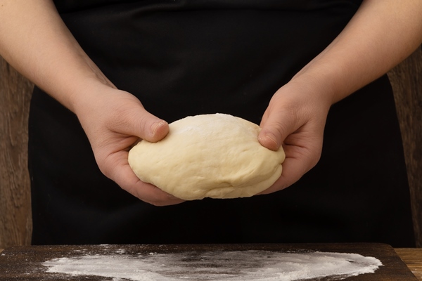 woman preparing yeast dough for pizza or pastry - Жаворонки постные ванильные