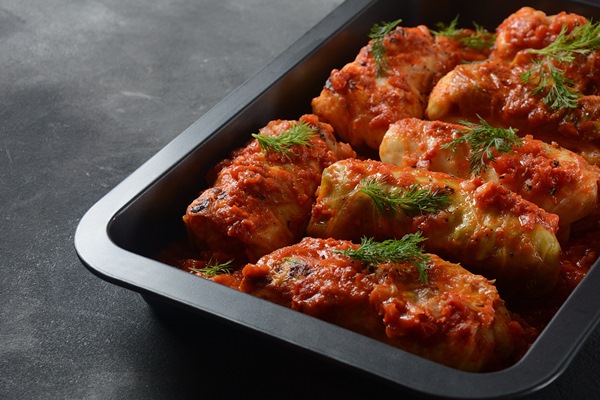 cabbage rolls with chicken meat and rice in tomato sauce stuffed cabbage leaves delicious dinner - Голубцы из лопуха овощные