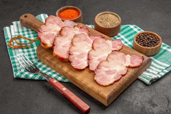 front view fresh sliced ham with seasonings on dark grey food meat raw photo - Запеканка с лебедой