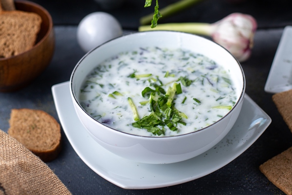 greens dovga white light soup with different herbs on grey - Лебеда с яйцом по-азербайджански