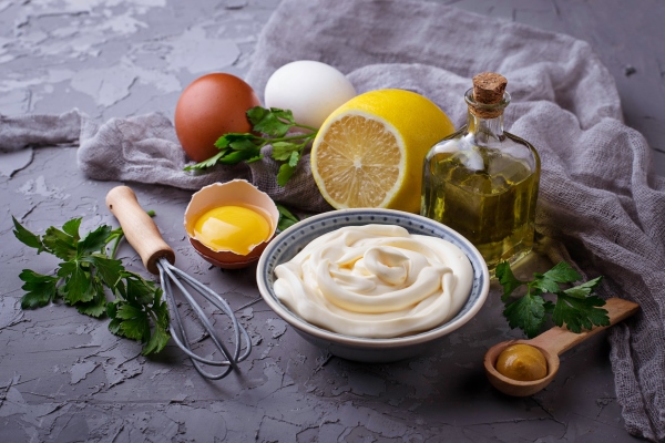 homemade mayonnaise sauce and olive oil eggs mustard lemon selective focus - Архангельский салат из трески