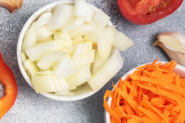 raw ingredients for cooking pilaf brown rice and chicken fillet grated carrots and chopped onions pepper tomato garlic herbs and spices gray background top view copy space - Суп из лосося с яблоками