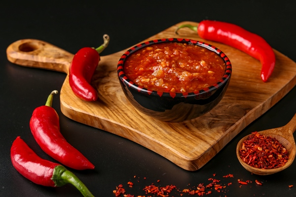traditional maghrebi hot chili pepper sauce paste harissa on dark background tunisia and arabic cuisine horizontal orientation closeup - Закуска овощная "Огонёк"