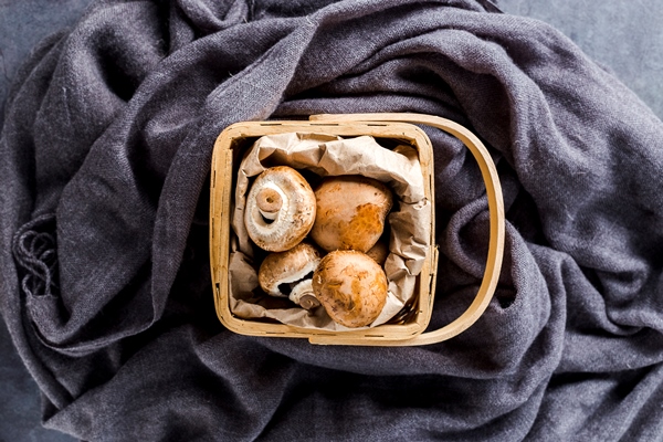 top view basket full of mushrooms - Свинина с каштанами и грибами