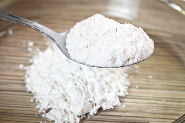 white wheat flour in a metal spoon - Капустный взвар