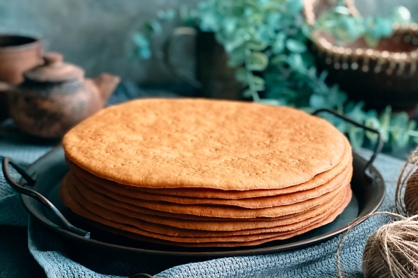 cooking honey cake at home round baked cake layers stacked on plate - Торт "Медовик" классический