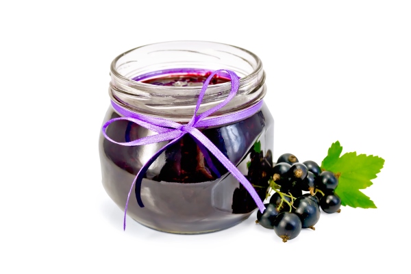 glass jar with black currant jam twigs with berries and leaves of black currant isolated on white background - Камберлендский соус (английская кухня)
