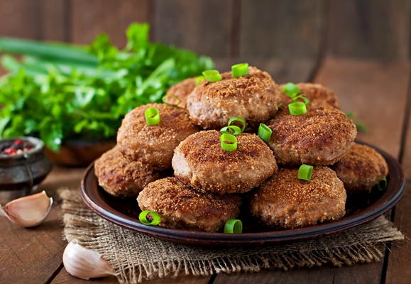 juicy delicious meat cutlets on a wooden table in a rustic style - Котлеты "Школьные"