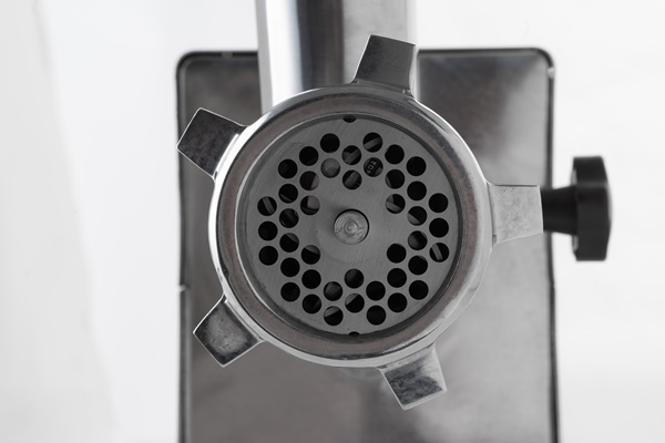 metal meat grinder isolated on white background close up - Печёночные оладьи